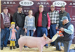 A group of people with a prize-winning pig