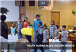 Young people attend an event during Black History Month