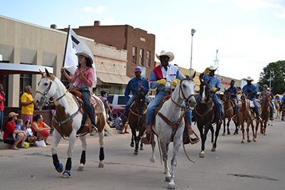 People riding horses during a parade