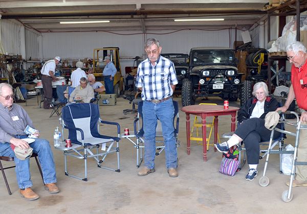 A group of older people in chairs