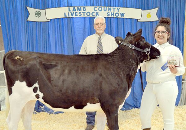 People with a prize-winning cow