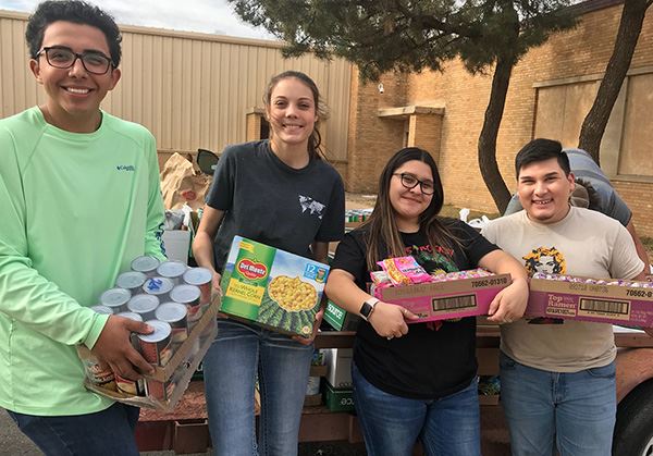 Youths with collections of food